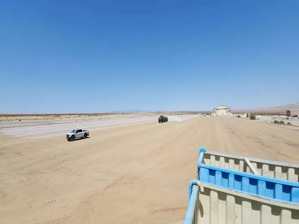 Water tanker applying treatment on runway
