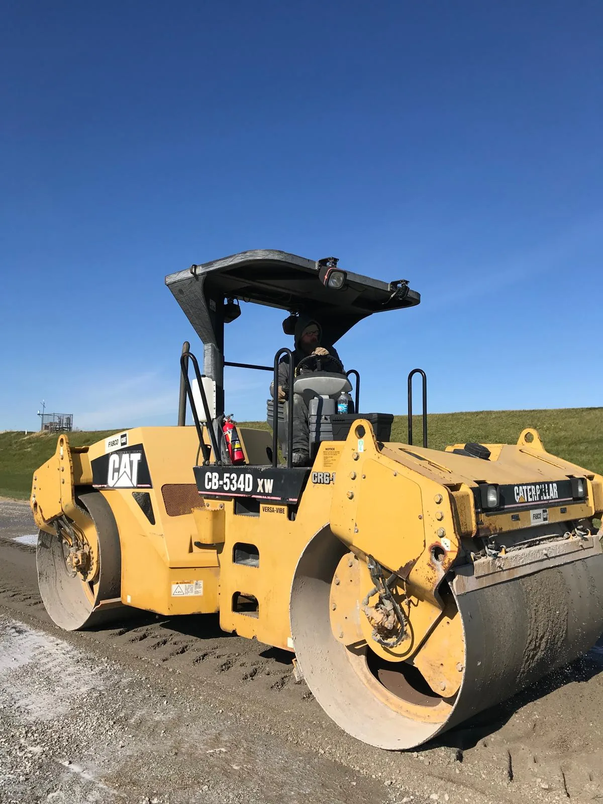 Vibratory steel-drum roller compacting the LL-TECH treated layer